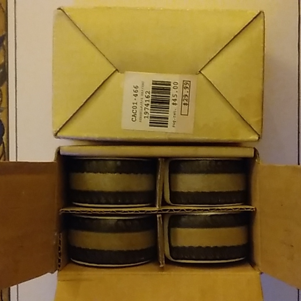 Mikasa Arabella napkin rings two sets of four.